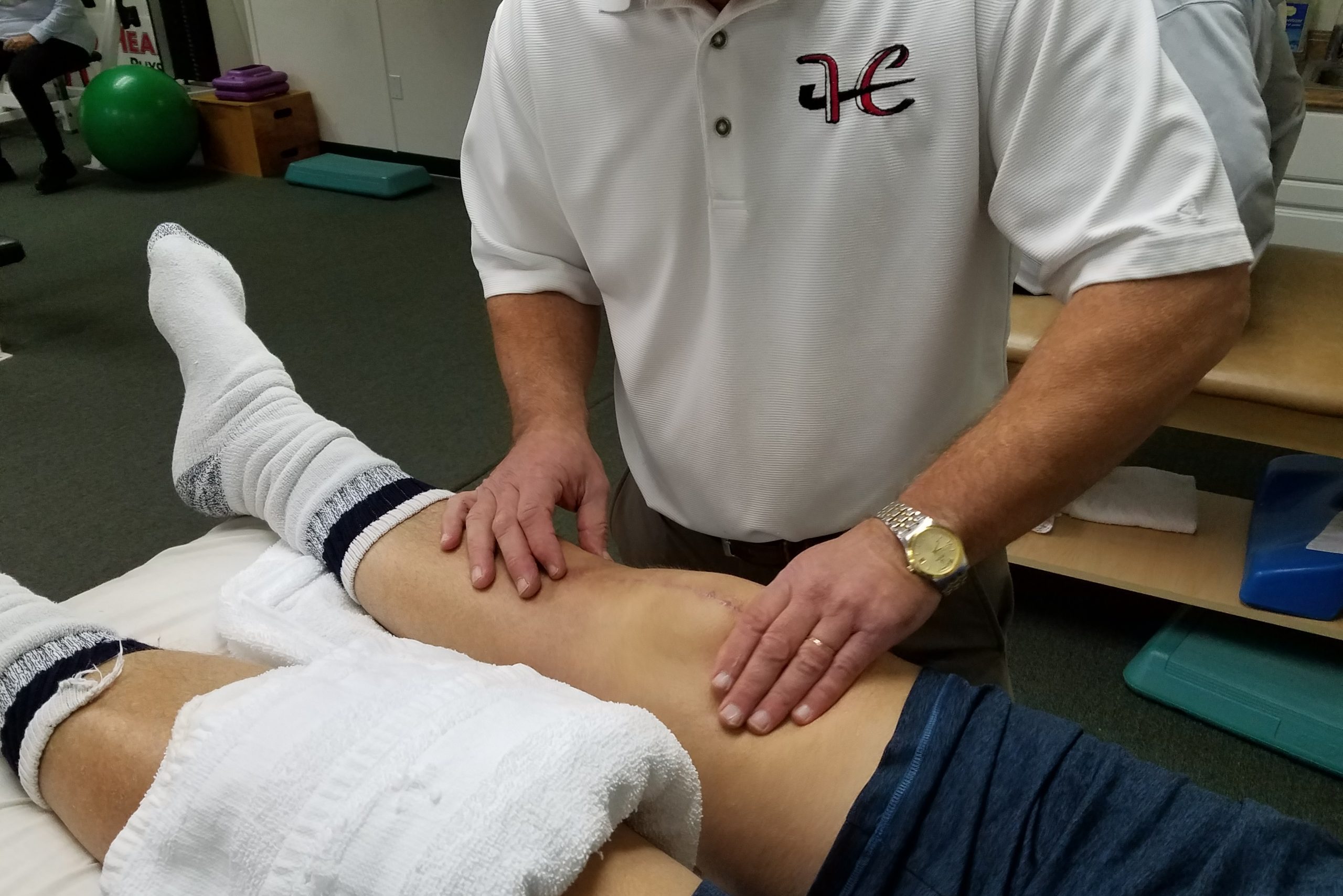 client undergoing therapy after a knee replacement